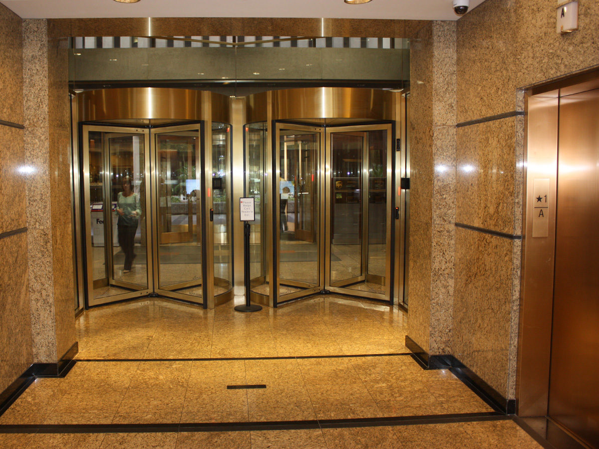 interior view of new automatic revolving doors accessing elevators